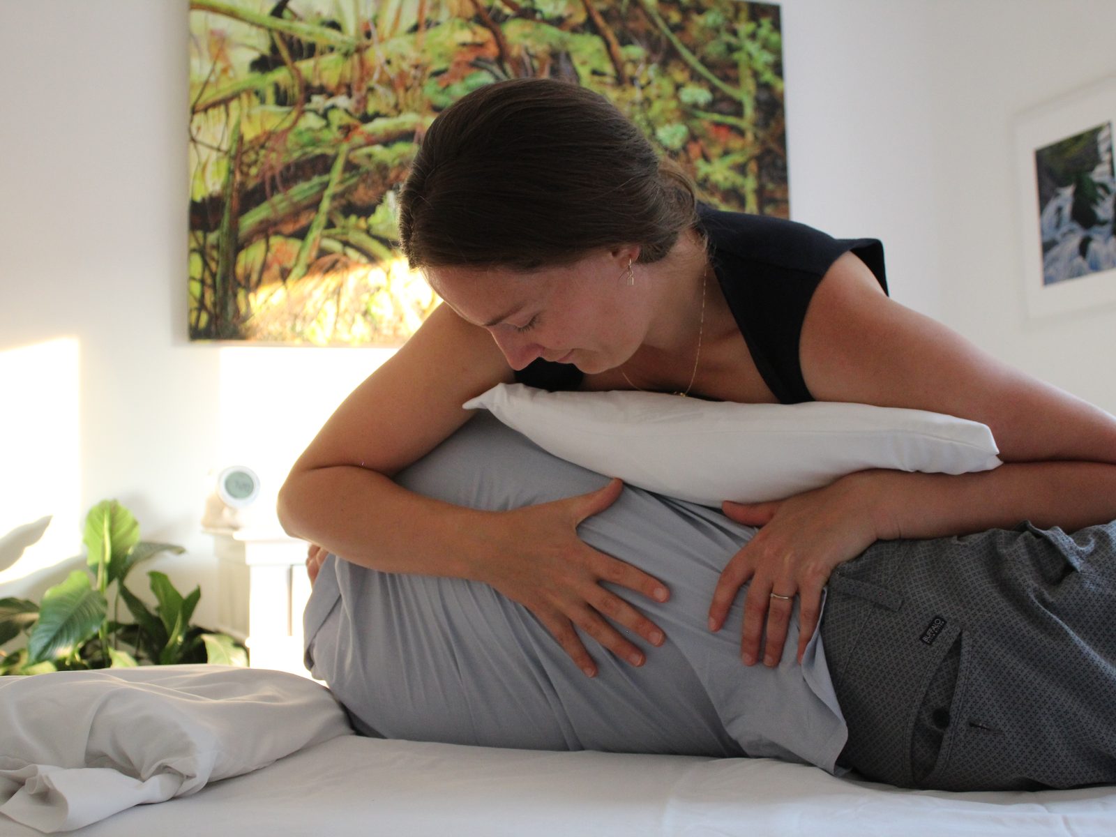Erin Chaba performing an osteopathic treatment, working with a client lying on their side.